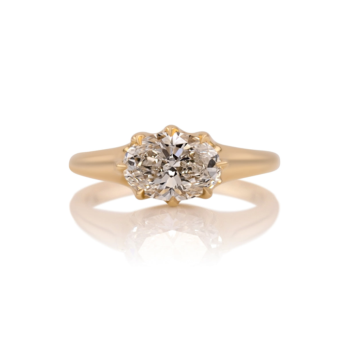 1.70ct oval lab diamond east west ring in 14k gold, shown head on against a white background