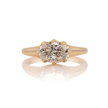 1.70ct oval lab diamond east west ring in 14k gold, shown head on against a white background