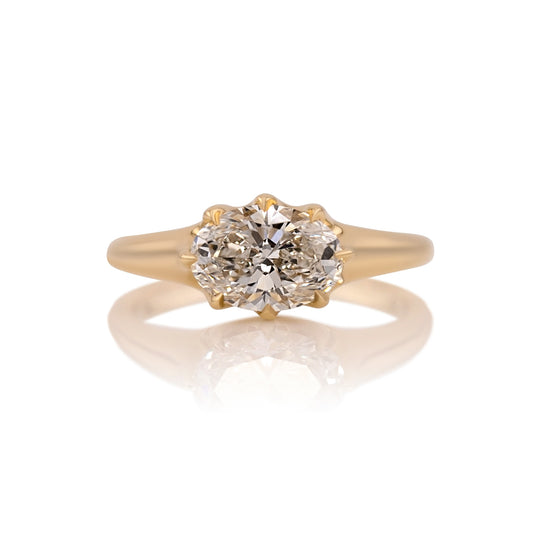 1.70ct oval lab diamond east west ring in 14k gold, shown head on against a white background