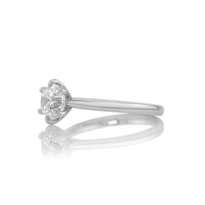 Side profile of the Lena solitaire showing the platinum band and prong setting