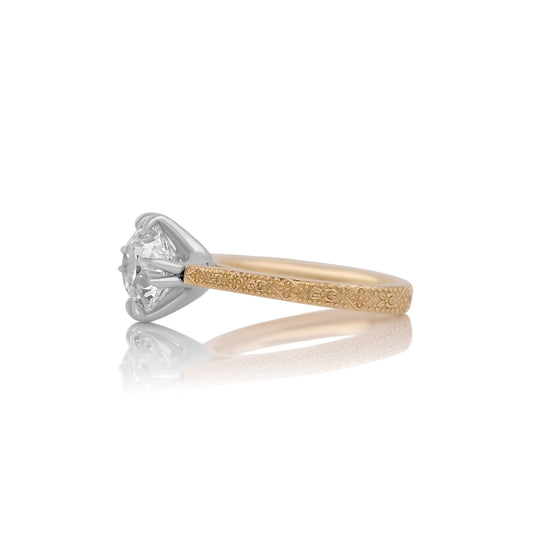 Side profile of the Daphne ring showing the platinum head on a yellow gold band