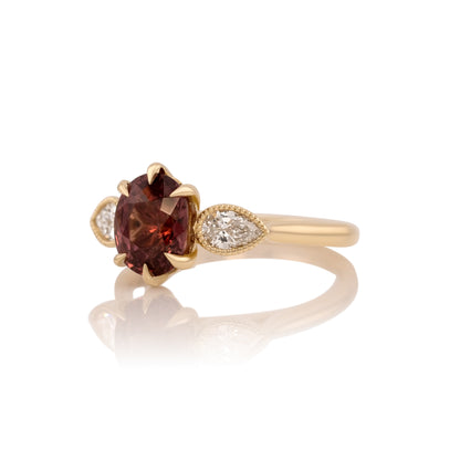 Side profile of the Malaya garnet ring showing the setting and band