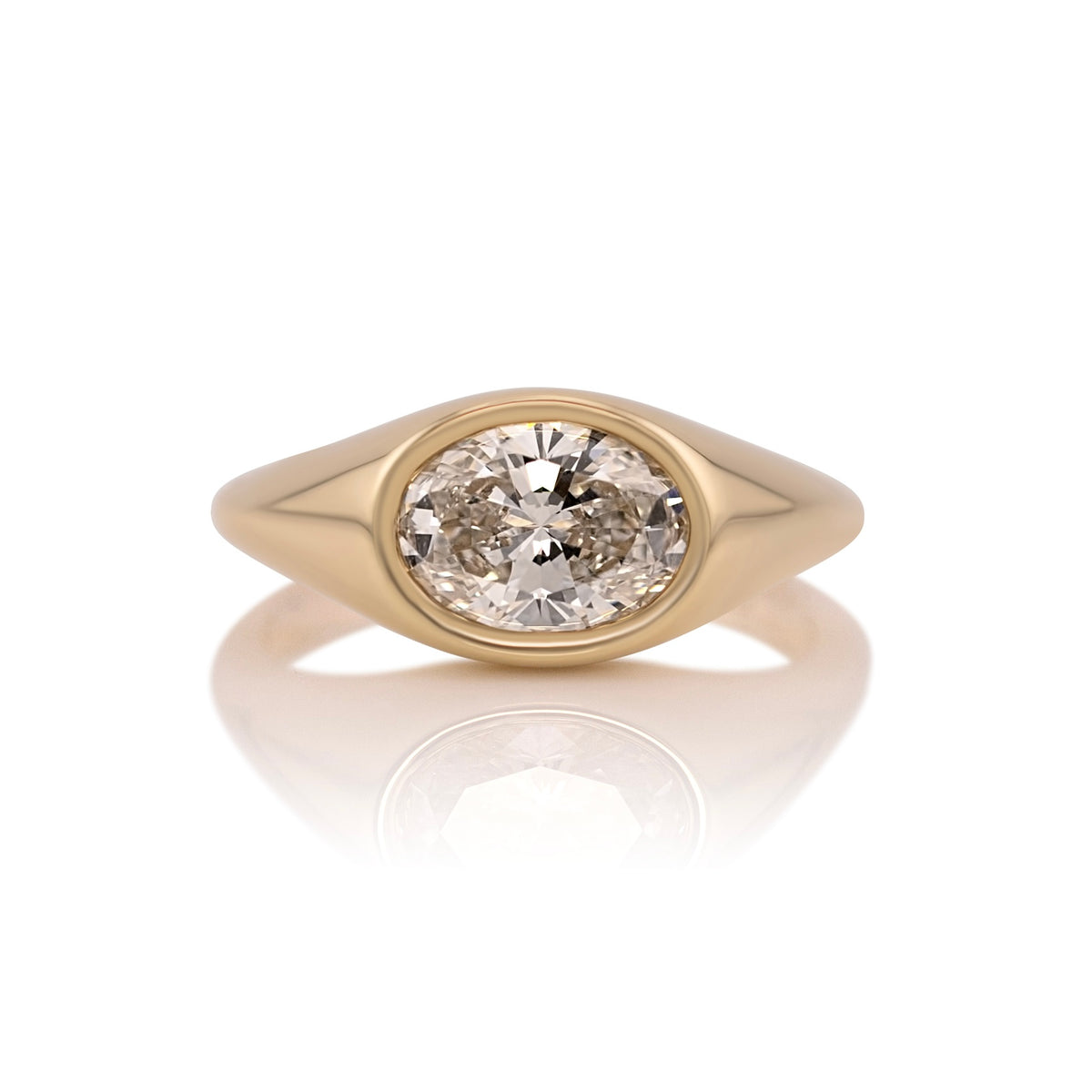 1.59ct oval lab diamond east west ring in 14k yellow gold, shown head on against a white background