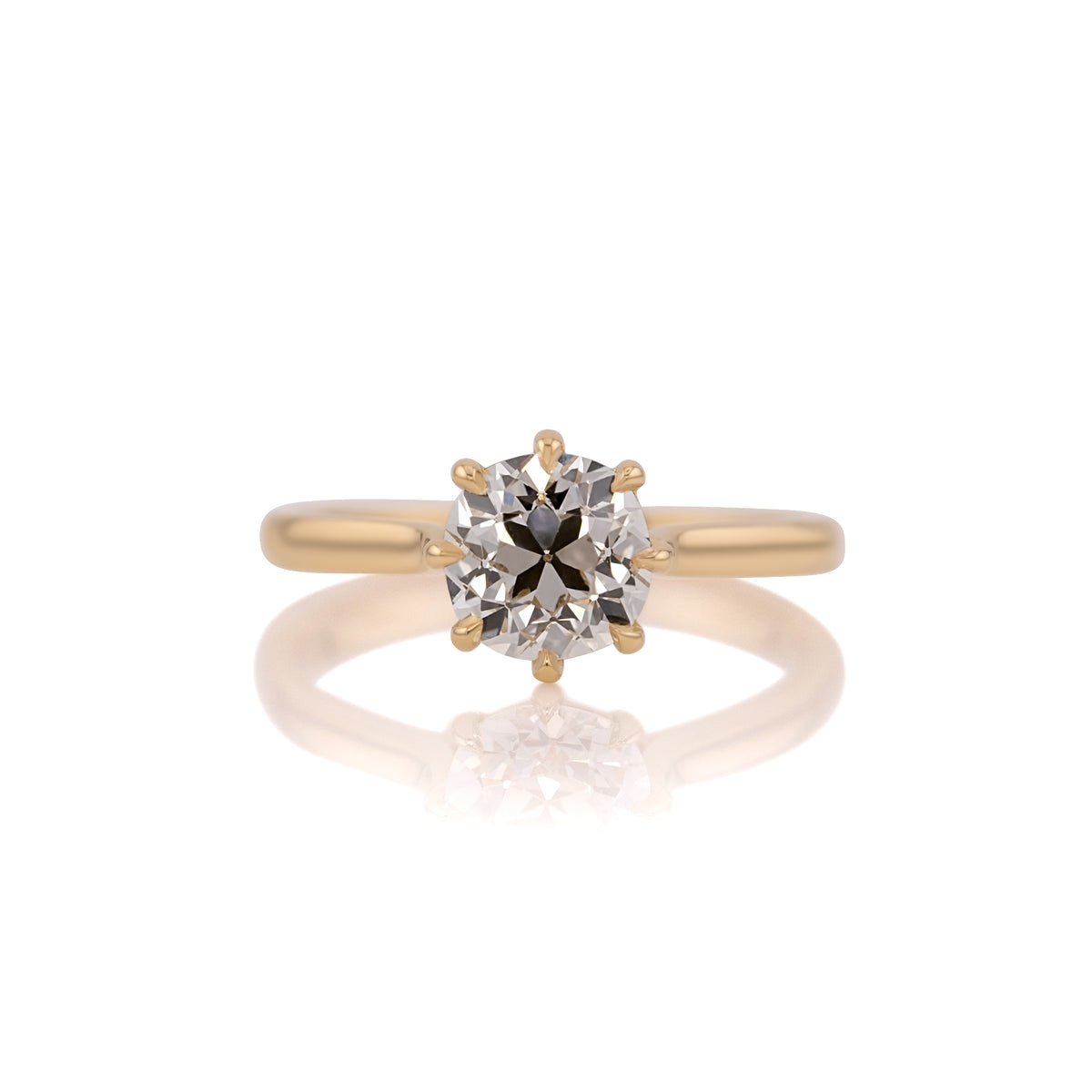 1.58ct old mine cut lab diamond cathedral solitaire in 14k yellow gold, shown head on against a white background