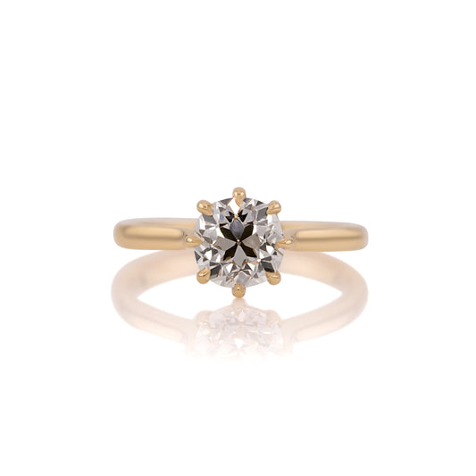 1.58ct old mine cut lab diamond cathedral solitaire in 14k yellow gold, shown head on against a white background