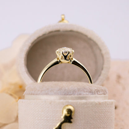 Sculptural openwork basket beneath the rose cut center stone