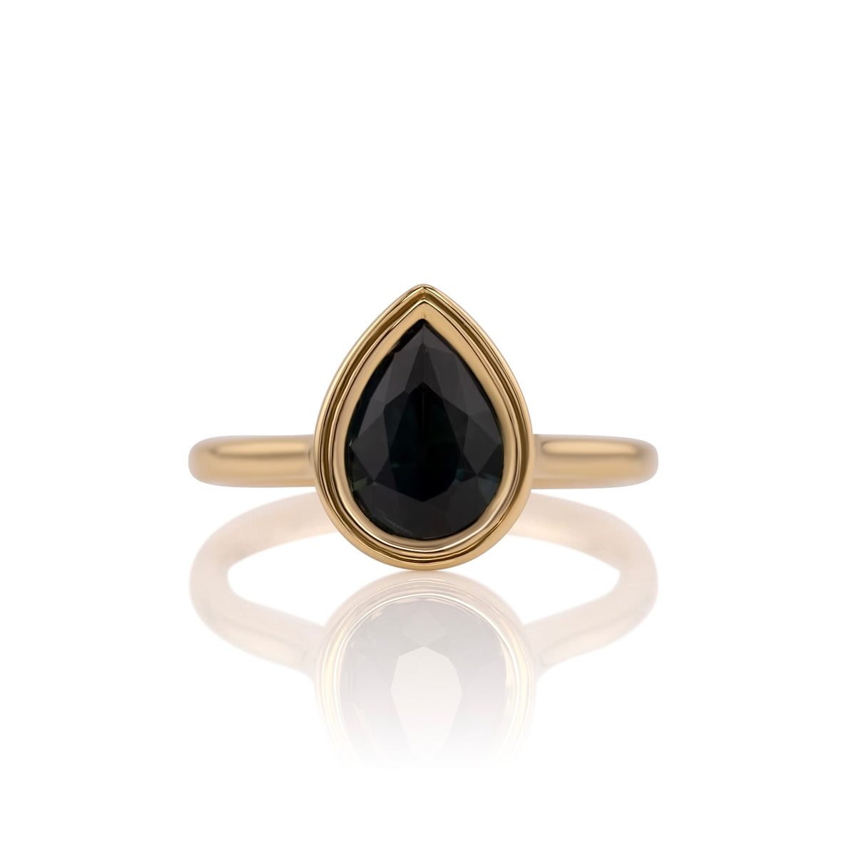 2.20ct natural sapphire pear double bezel ring in 14k yellow gold, shown head on against a white background