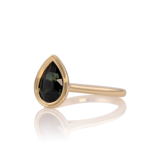 Side profile of the sapphire pear ring showing the double bezel setting