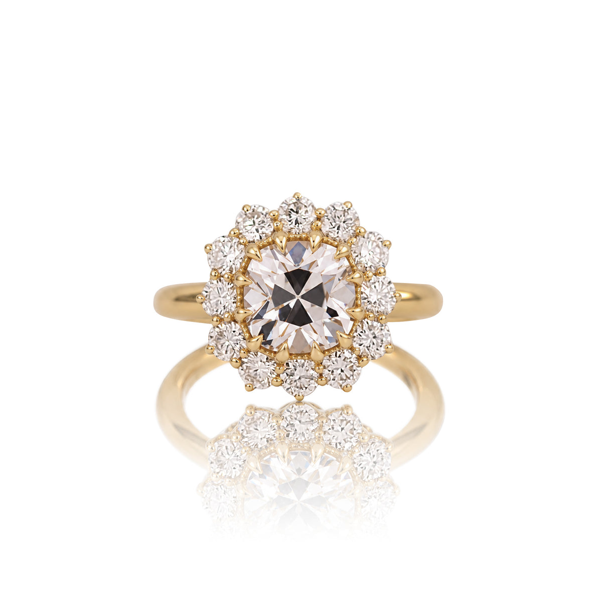 2.64ct old mine cut halo ring in 14k yellow gold, shown head on against a white background