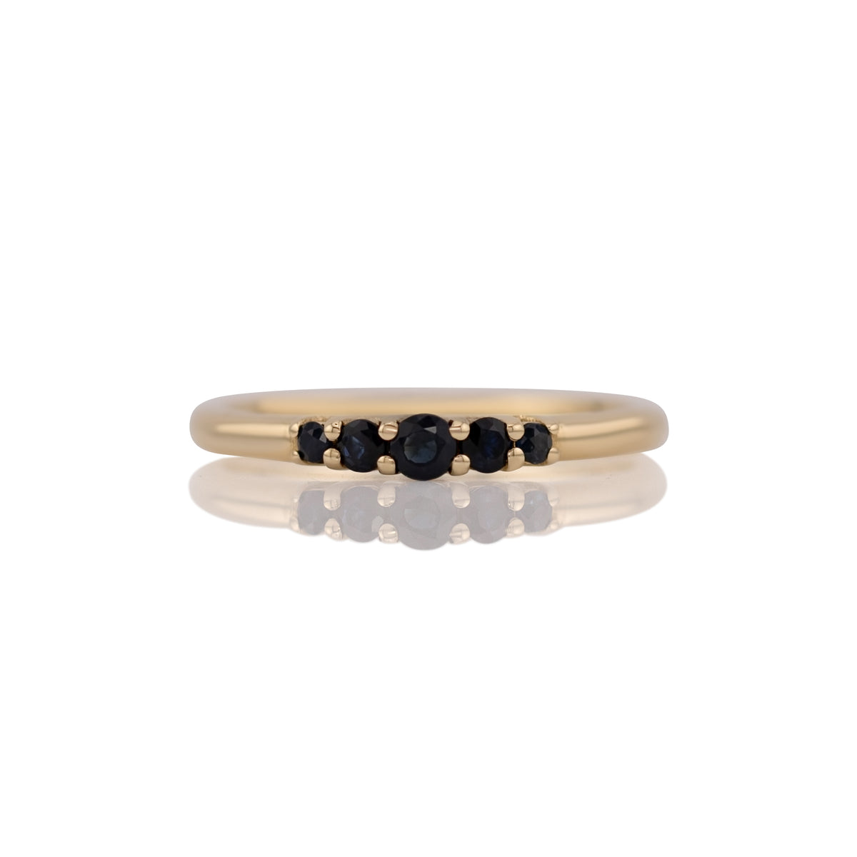 Lab grown sapphire five stone band ring in 14k yellow gold, size 8, shown head on against a white background