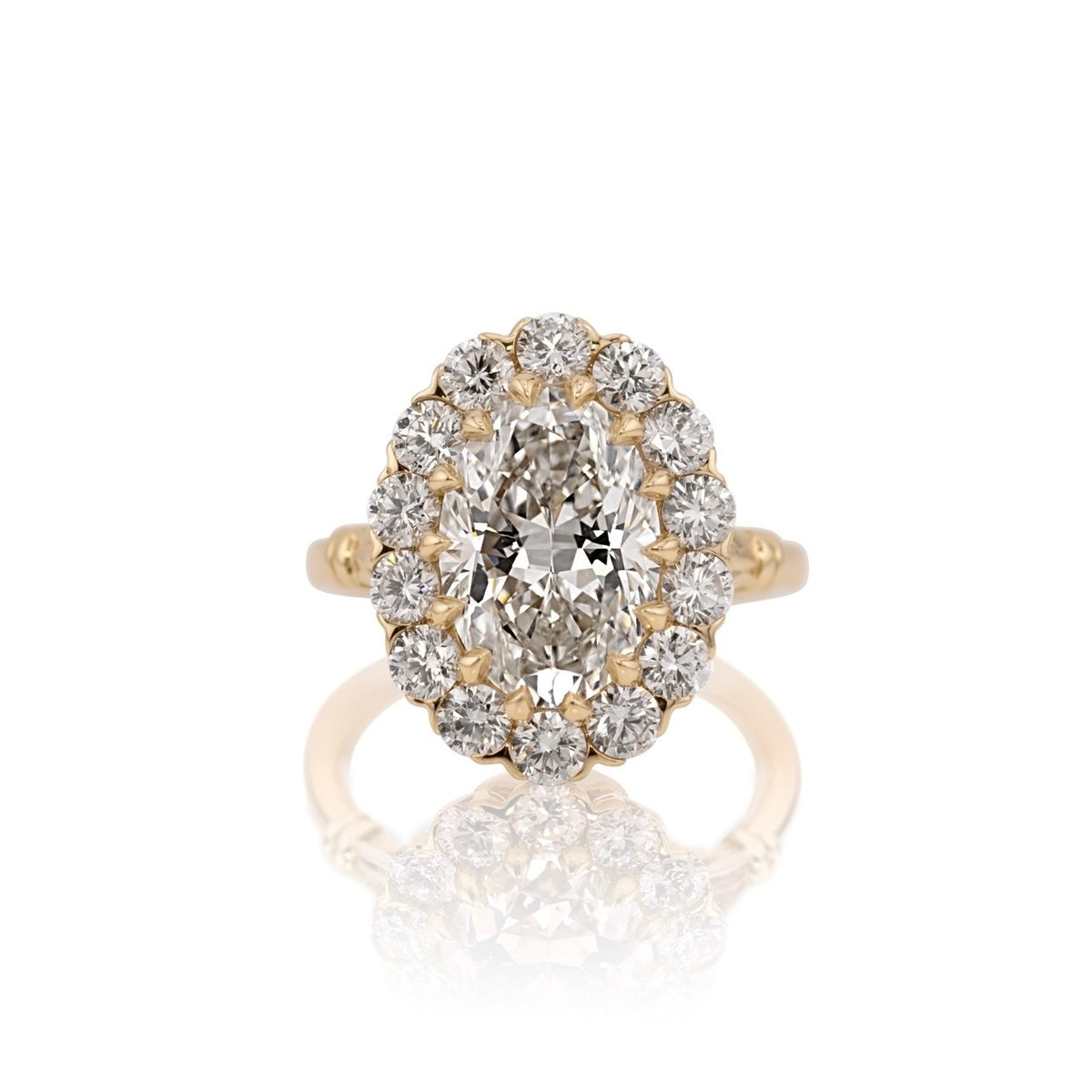 4.01ct oval lab diamond halo ring in 14k yellow gold, shown head on against a white background