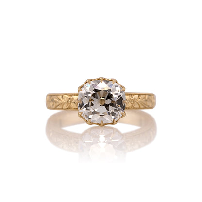 2.59ct old mine cut lab diamond hand engraved ring in 14k yellow gold, shown head on against a white background
