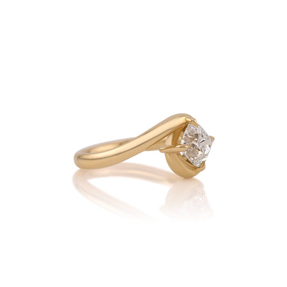 Side profile of the bypass ring showing how the band crosses beneath the center stone