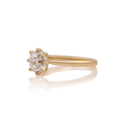 Side profile of the Juliette ring showing the cathedral shoulders rising to the center stone