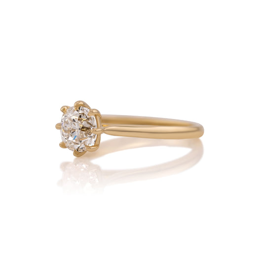 Side profile of the Juliette ring showing the cathedral shoulders rising to the center stone