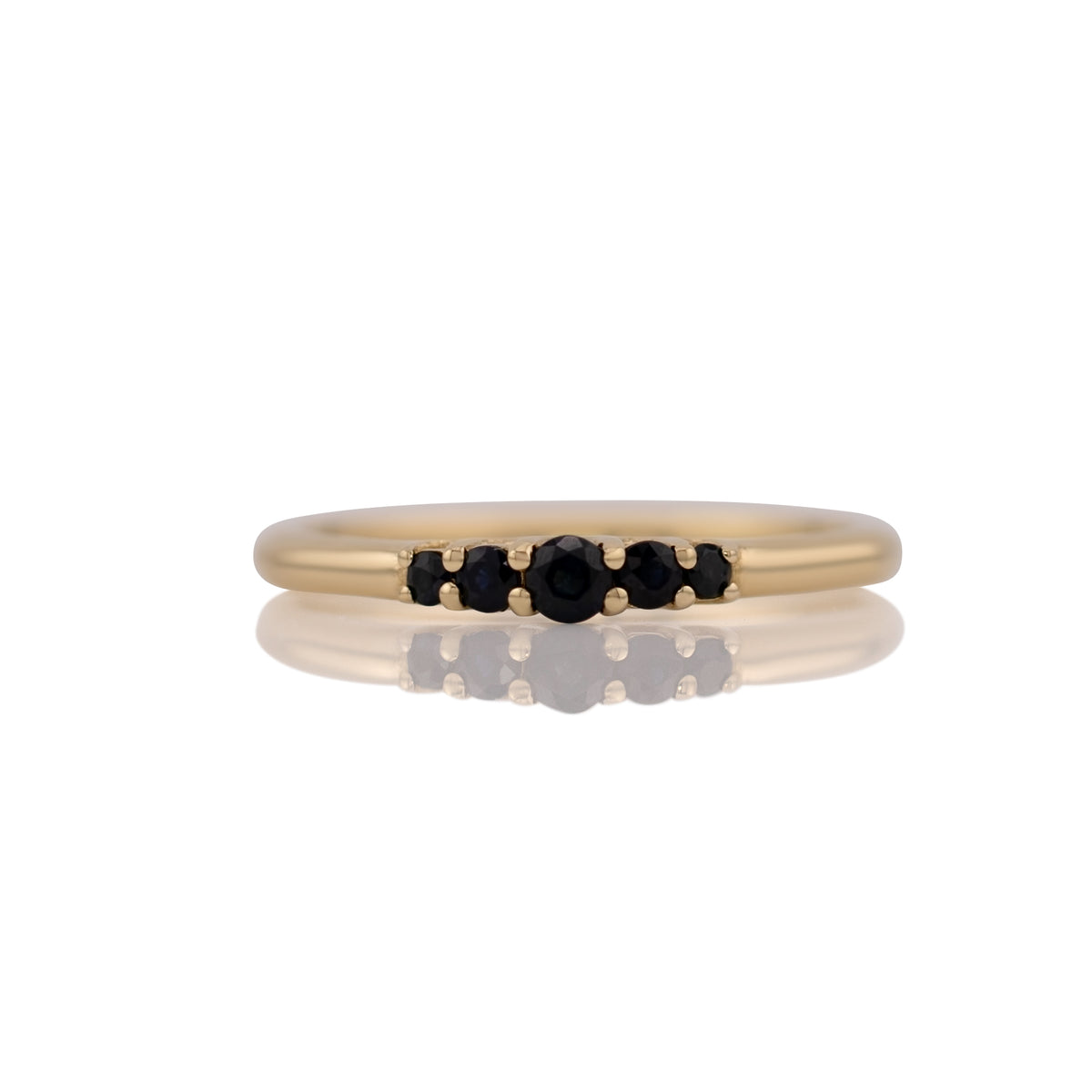 Lab grown sapphire five stone band ring in 14k yellow gold, size 10, shown head on against a white background