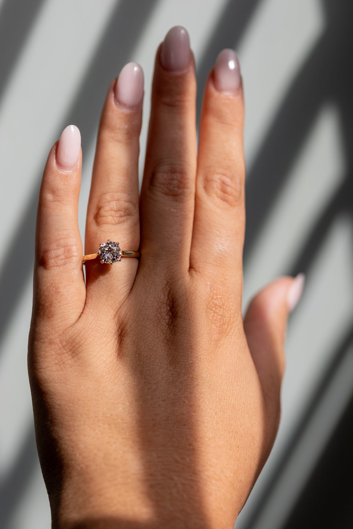 Juliette 1.58ct old mine cut cathedral solitaire worn on the hand in 14k yellow gold