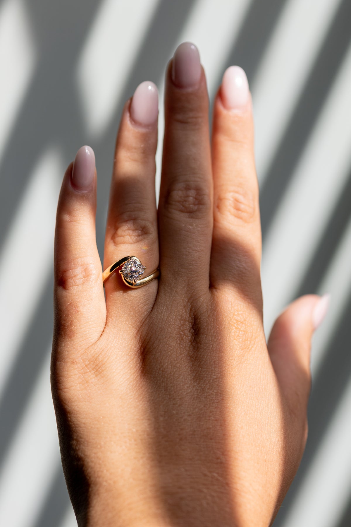 1.50ct old mine cut bypass ring worn on the hand in 14k yellow gold