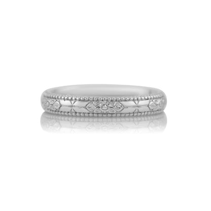 Orange blossom hand engraved wedding band in 14k white gold, size 6, shown against a white background
