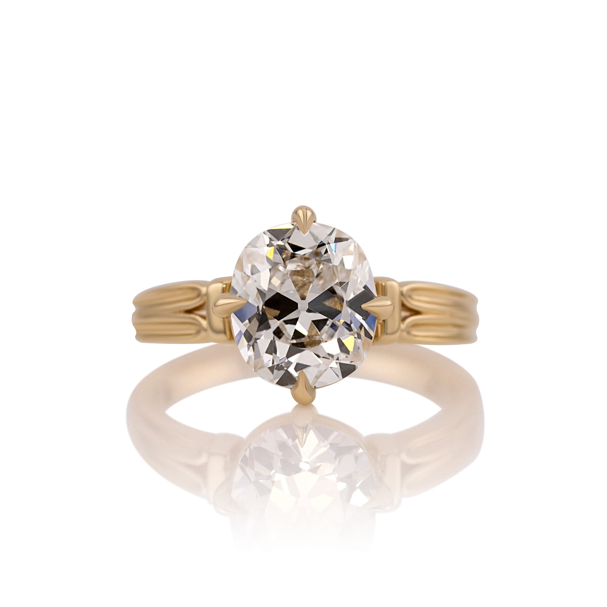 3.01ct old mine cut lab diamond solitaire ring in 14k yellow gold, shown head on against a white background