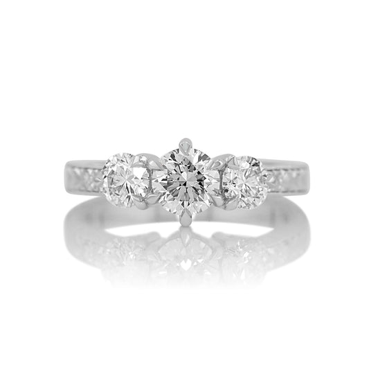 1.38ctw round brilliant lab diamond three stone ring in 14k white gold, shown head on against a white background