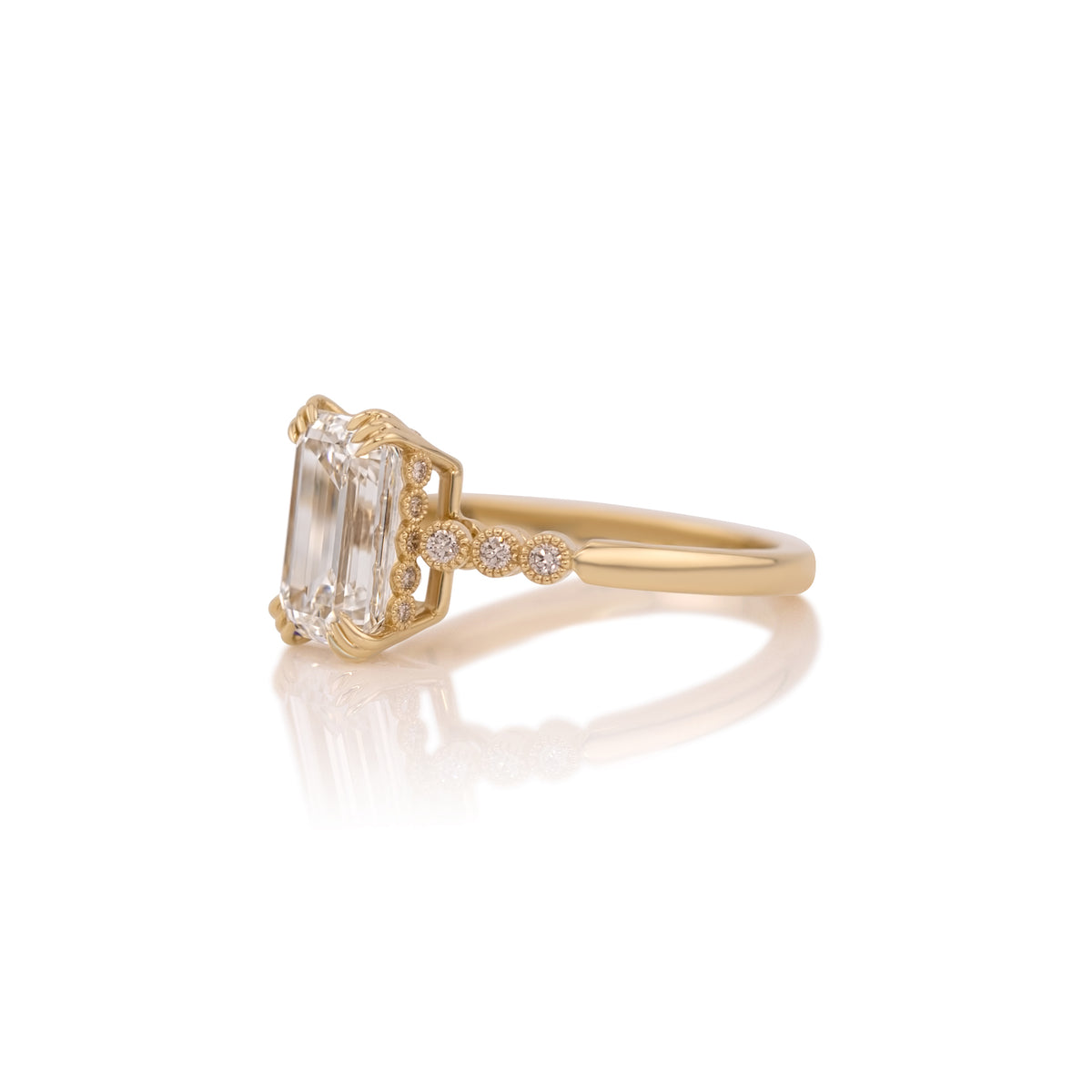 Side profile of the Celeste emerald cut ring showing the hidden halo