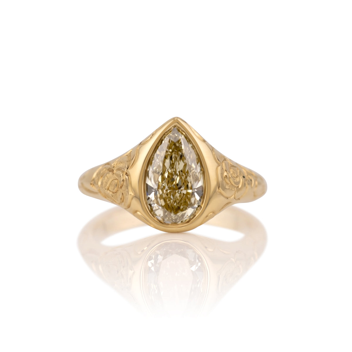 2.09ct champagne pear lab diamond bezel ring in 14k yellow gold, shown head on against a white background