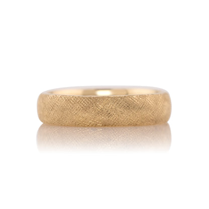5mm Florentine texture wedding band in 14k yellow gold, shown head on against a white background