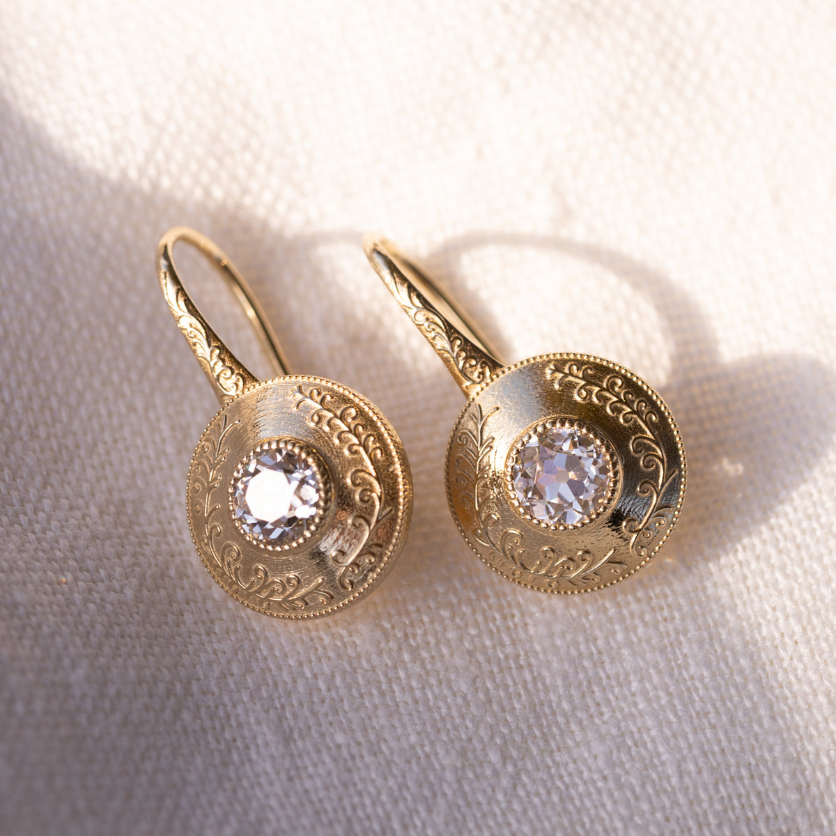 1.20cttw old European cut lab diamond drop earrings in 14k yellow gold, shown against a white background