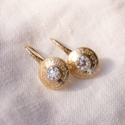 Side view of the Simone drop earrings showing the elongated engraved ear wires