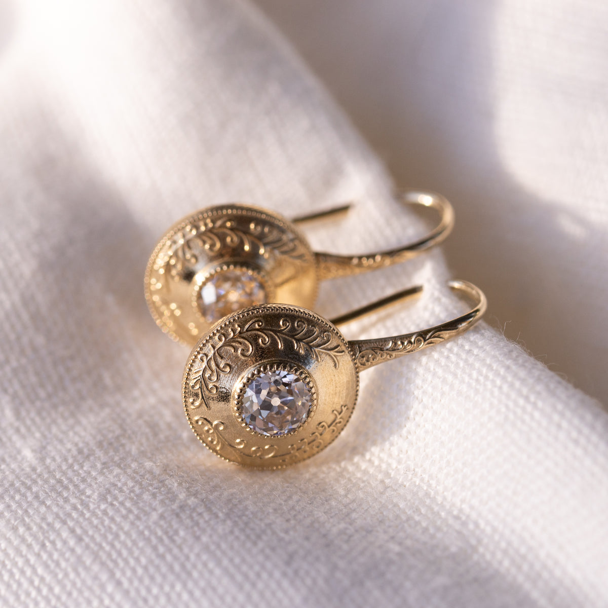 Simone earrings, warm K to L old European cut diamonds in milgrain bezels
