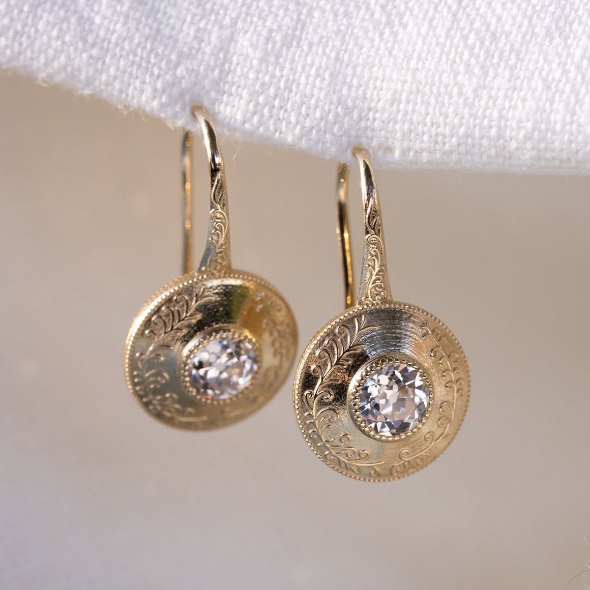 Broad chunky facets of the old European cut diamonds catching light
