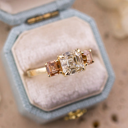 Etta Asscher three stone ring worn on the hand in 14k yellow gold