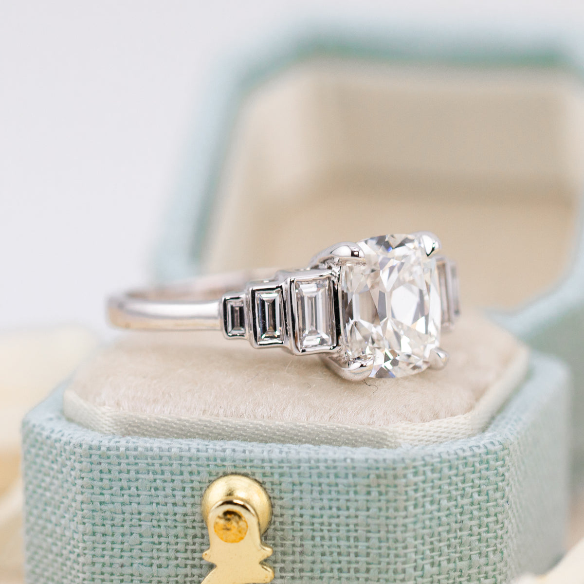 Slightly elongated 1.26 ratio old mine cut diamond in a white gold solitaire