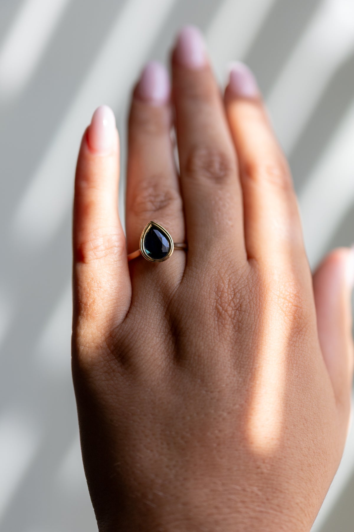 2.20ct natural sapphire pear double bezel ring worn on the hand