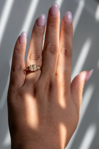 Etta 2.05ct Asscher three stone ring worn on the hand in 14k yellow gold