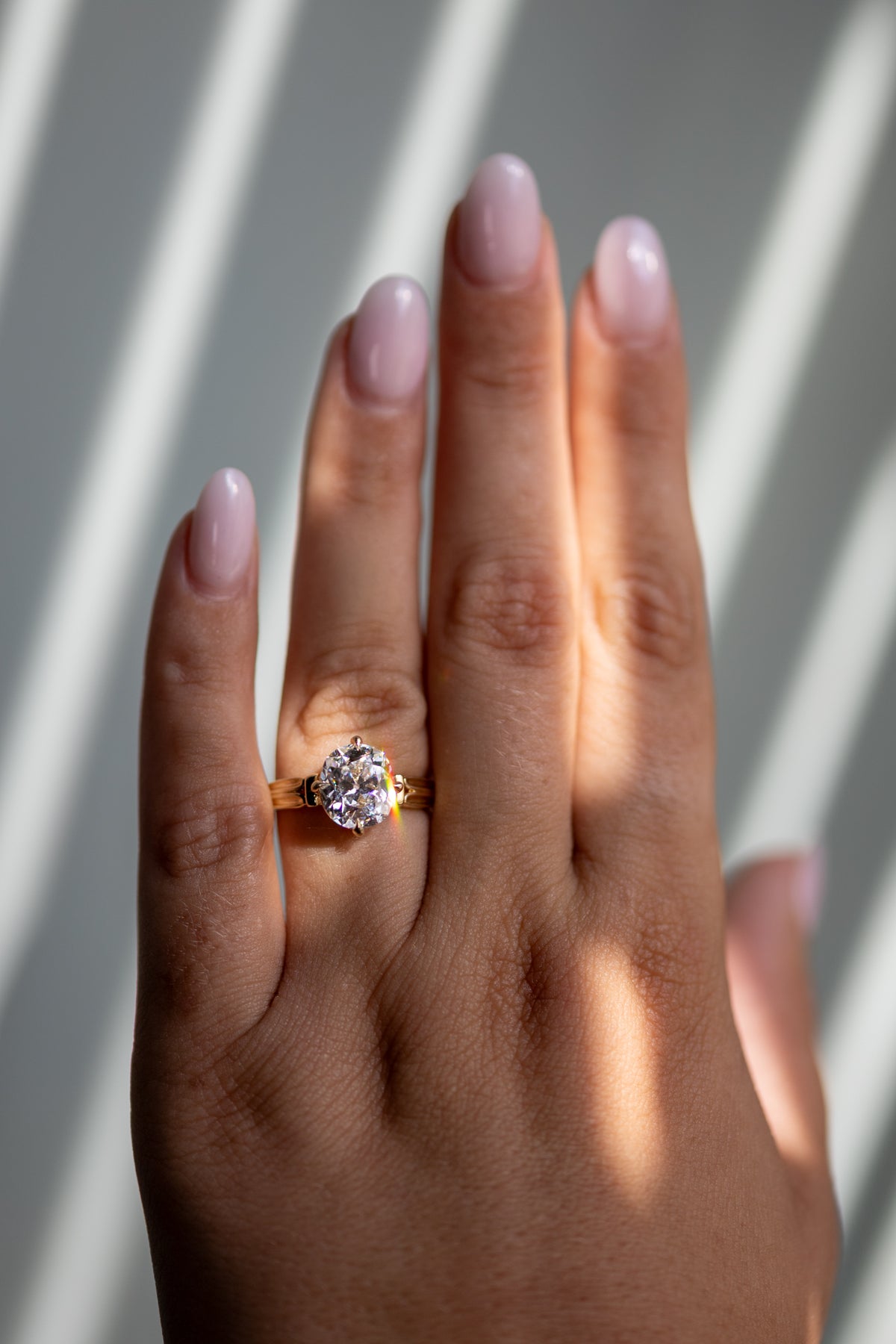 Harriet 3.01ct old mine cut solitaire worn on the hand in 14k yellow gold