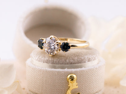 1.70ct Round cut three stone engagement ring with sapphire side stones