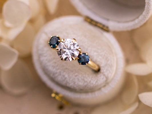 1.70ct Round cut three stone engagement ring with sapphire side stones