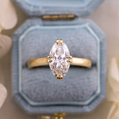 Vera engagement ring, an E color VS1 moval diamond with double claw prongs